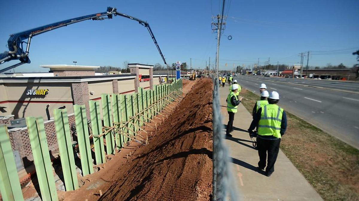 Workers build a retaining wall along N. Tryon St. as part of the LYNX Blue Line Extension project Thursday, Feb. 27, 2014. The 9.3-mile alignment will extend from Ninth Street in uptown through the North Davidson (NoDa) and University City areas, terminating on the UNC Charlotte campus.