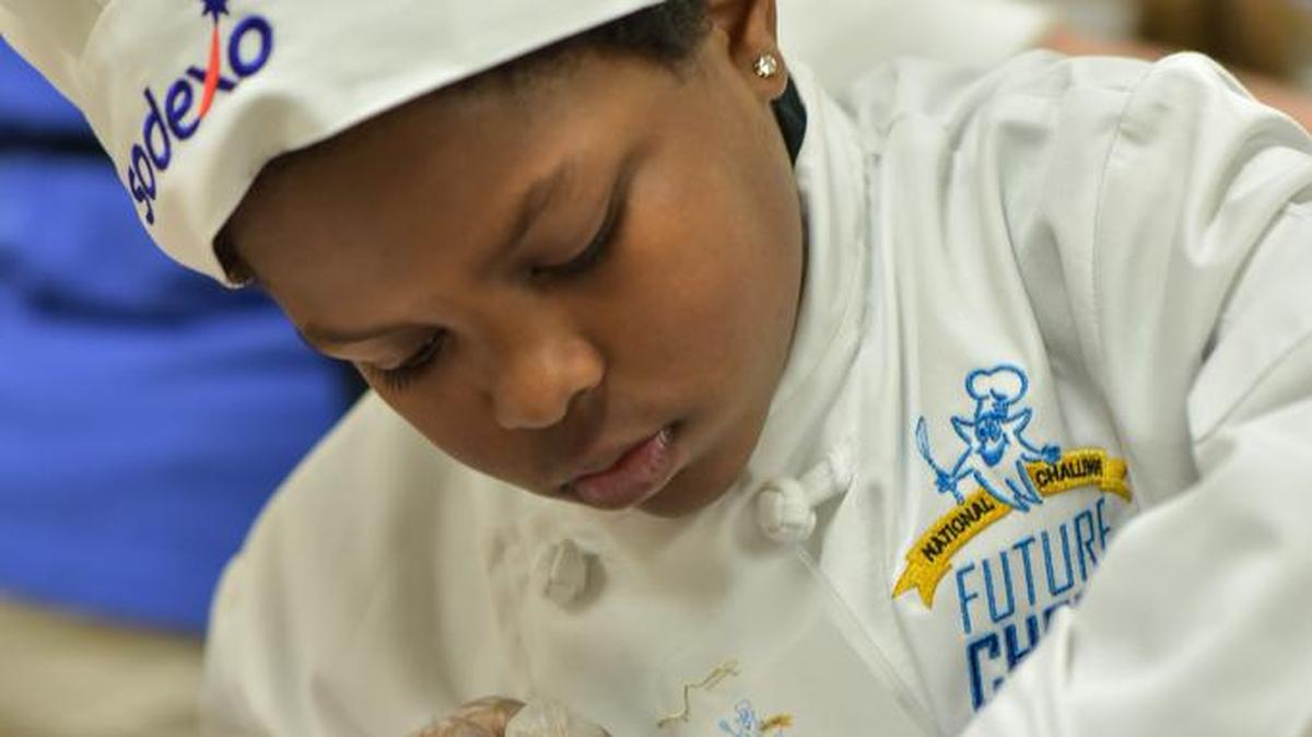 York Road Elementary third-grader Justin Woods prepares his Chocolate Peanut Butter Explosion Pie.