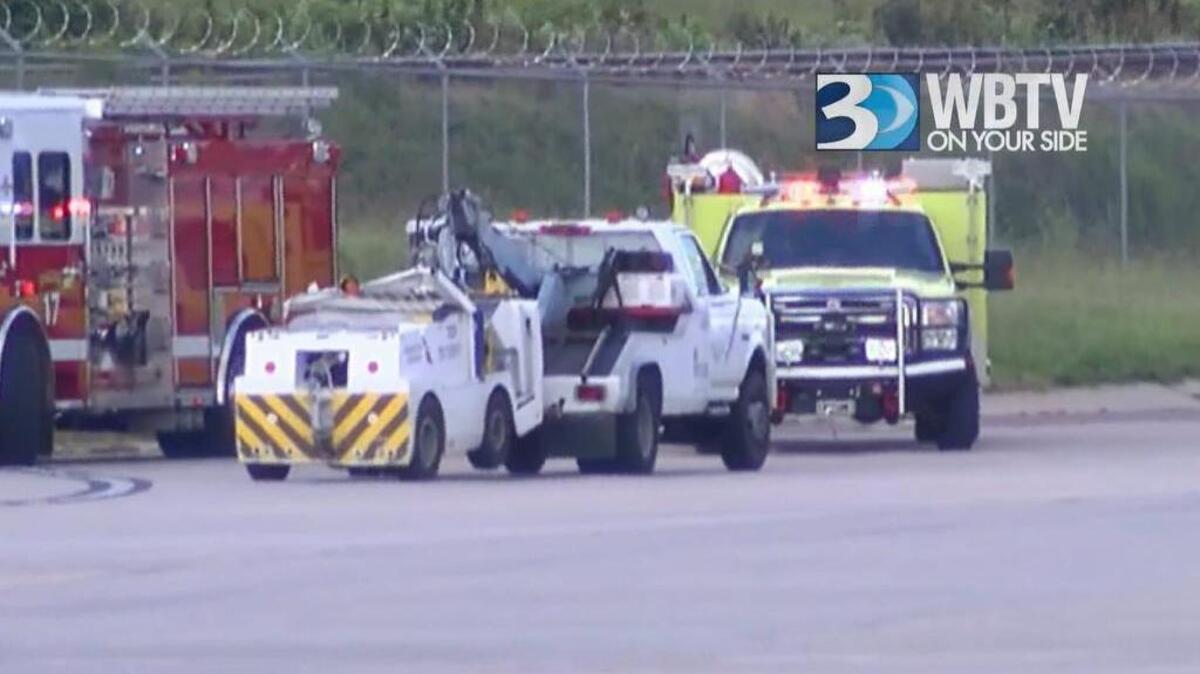 One person was hurt when an American Eagle plane hit a tug at Charlotte Douglas International Airport on Wednesday, American Airlines said.