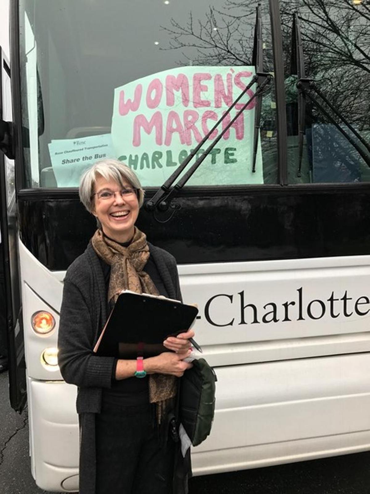 Jan Anderson, president of Charlotte Women’s March, in front of the bus that took a group to the march in Washington, D.C., in 2017.