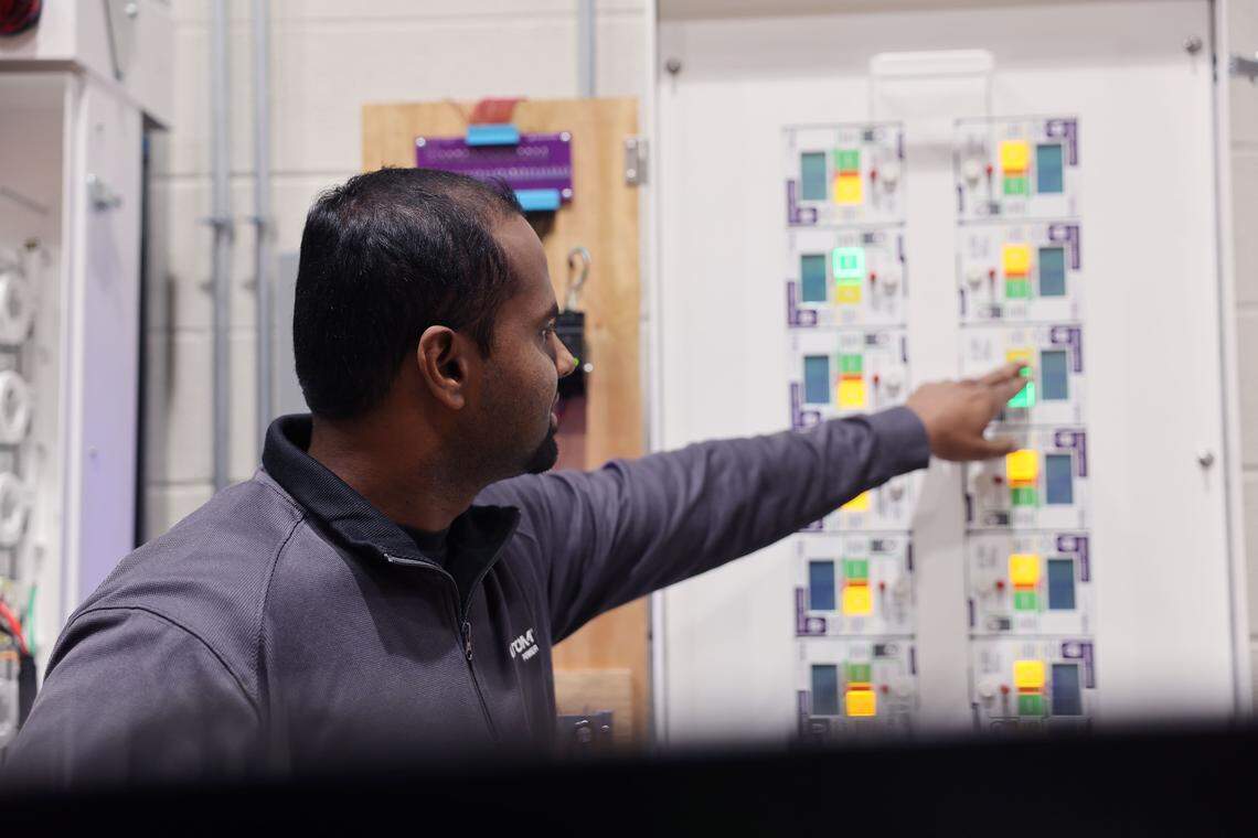 Benish Kumar, chief technology officer at Atom Power in Huntersville, points out how the solid-state circuit breaker panel works.