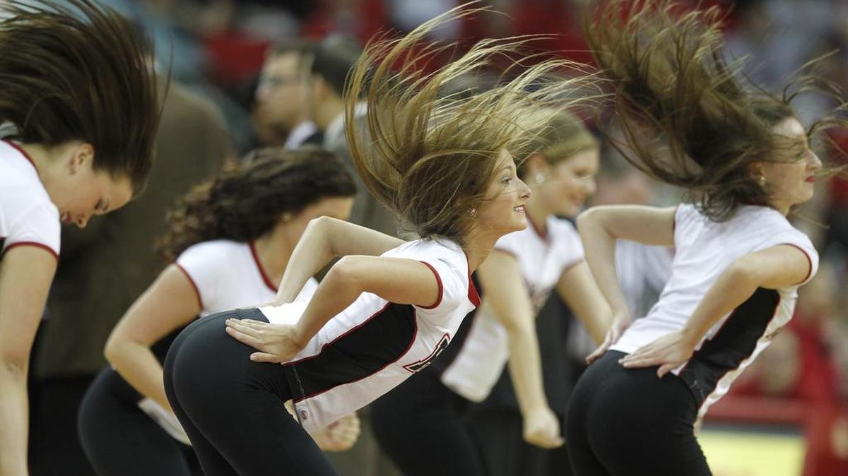 Elise Cournoyer and the N.C. State Dance Team performs during a timeout in the first half of N.C. State's game against Virginia at PNC Arena in Raleigh, N.C. Saturday, January 11, 2014.