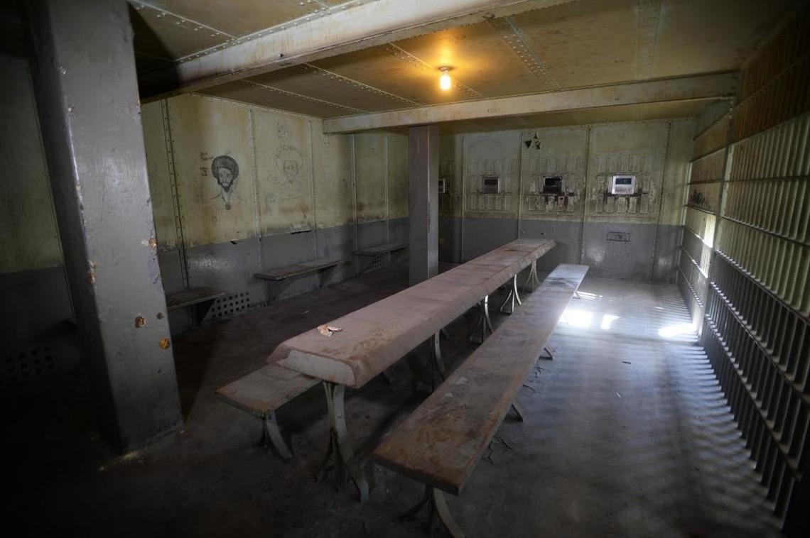 A dining area with visitation windows at back at the long-defunct Mecklenburg jail, which closed in the 1960s. Most of the jail has remained untouched since then, so you can still see graffiti left by inmates 50 years ago.