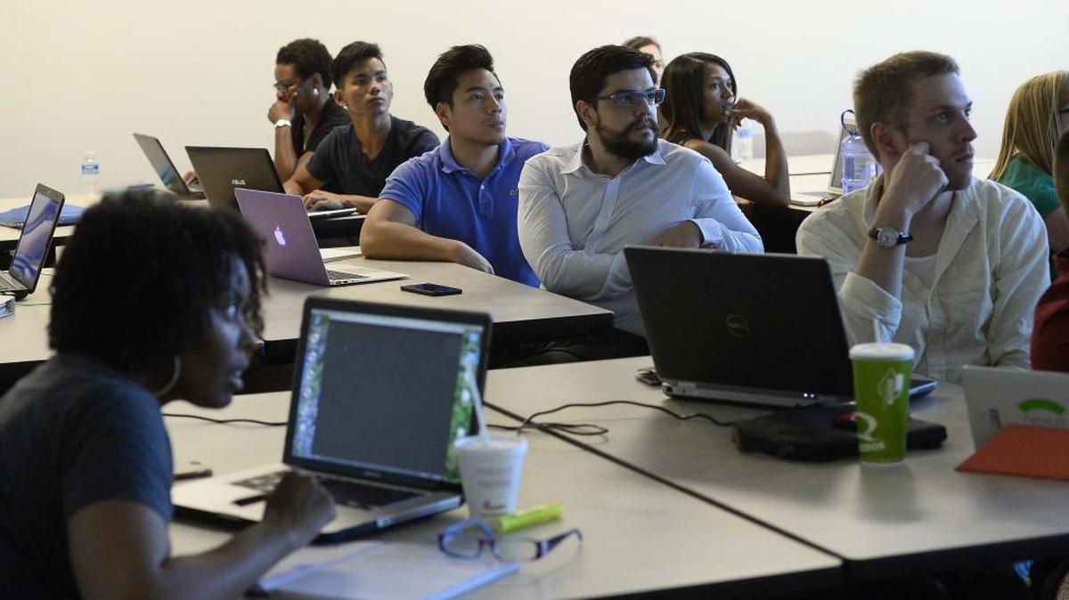 
Students work on computer coding during a "crash course" in computer programing hosted by The Iron Yard on August 18,2015.
