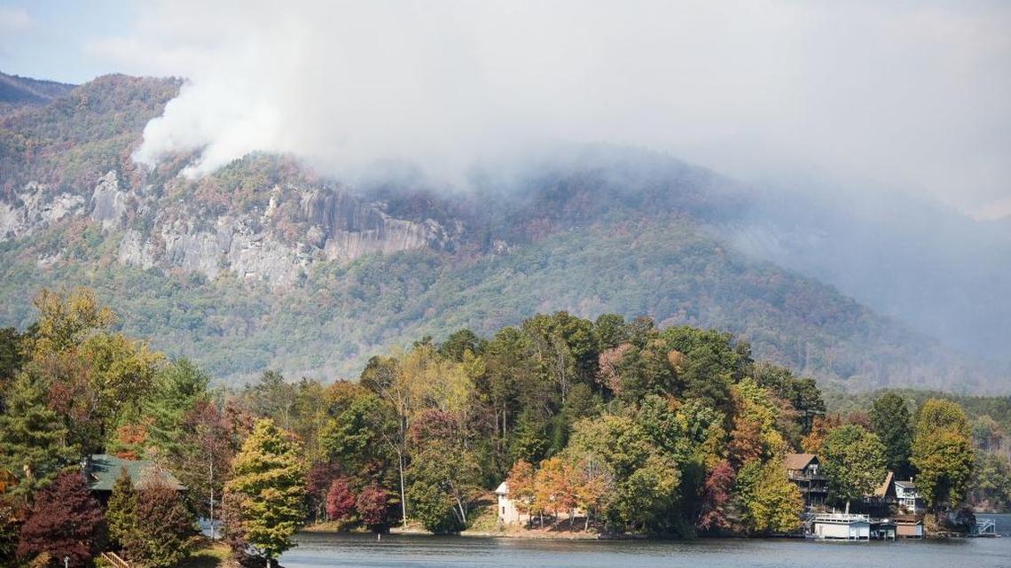 Smoke from the Party Rock fire near Lake Lure spreads as emergency services and the N.C. Forest Service work to contain the blaze on Wednesday at Lake Lure. Unseasonably warm dry weather has deepened a drought that’s igniting forest fires across the southeastern U.S.