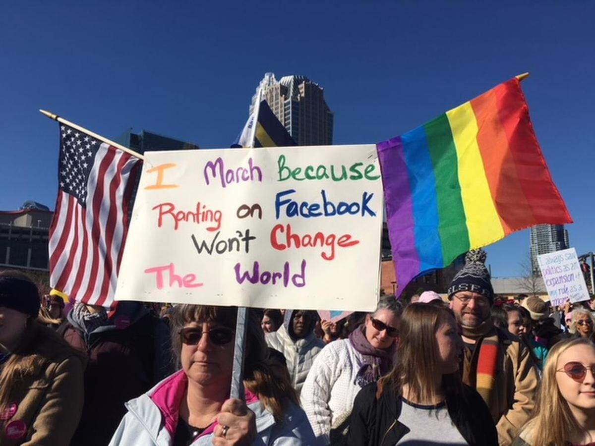 Marchers brought flags and signs with messages to Charlotte’s annual Women United March on Saturday.
