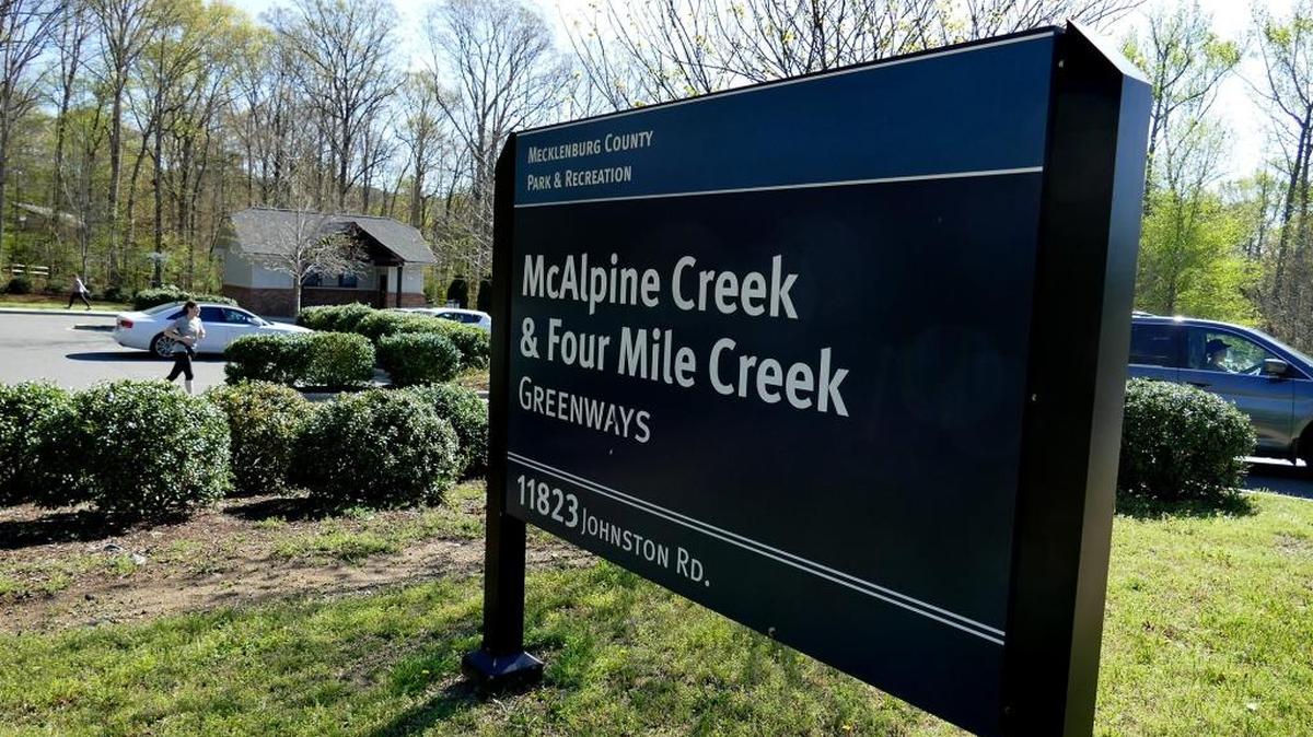 The entrance to McAlpine & Four Mile Creek Greenways in the 11800 block of Johnston Road.