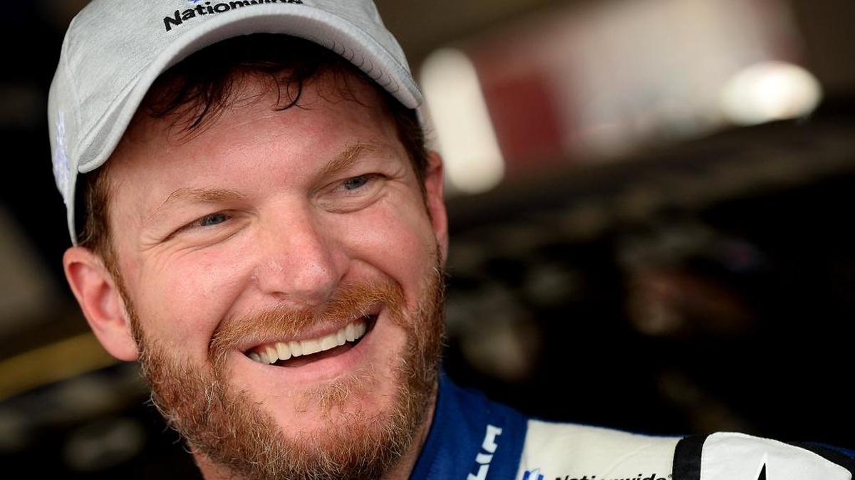Dale Earnhardt Jr. laughs as he talks with a reporter following the final practice for the Daytona 500 at Daytona International Speedway on Feb. 25, 2017. Earnhardt’s 2018 New Year’s Resolution to cycle 50 to 100 miles a week is drawing lots of online love.