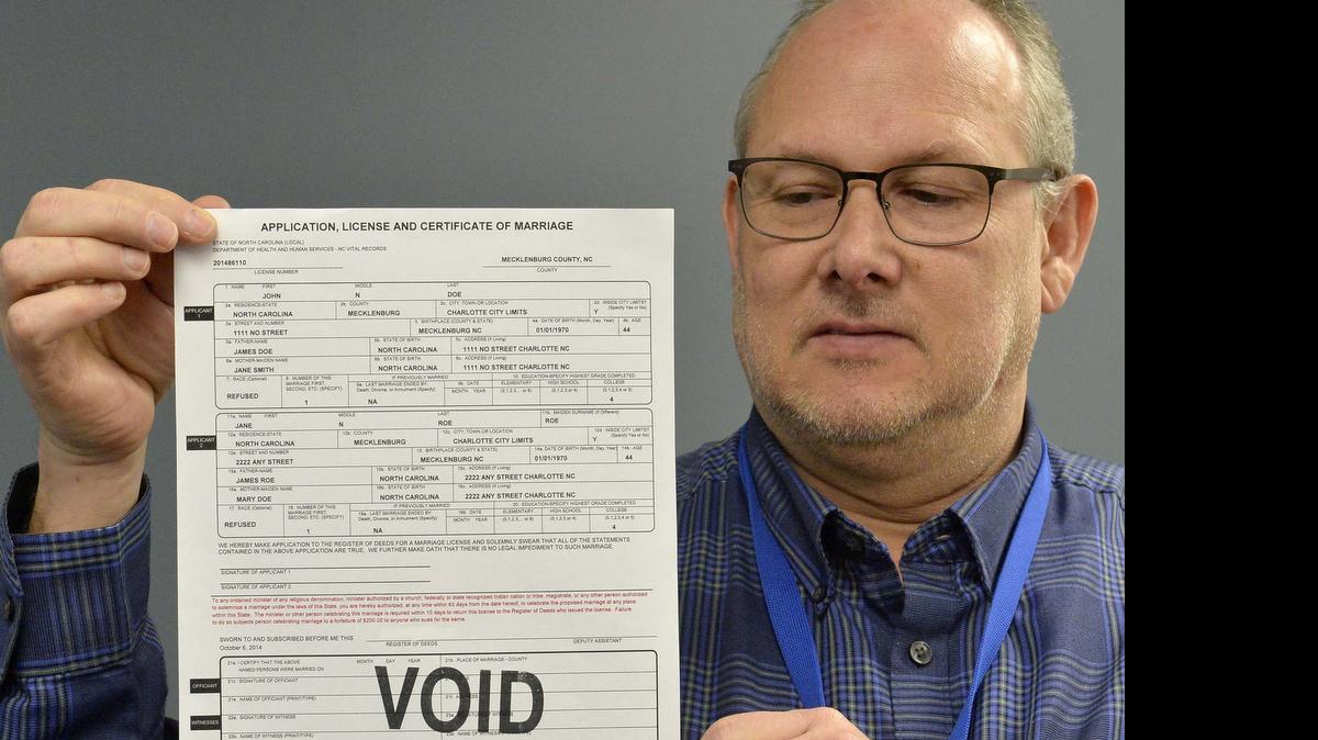 
Mecklenburg County Register of Deeds David Granberry with a new amended marriage license form.
