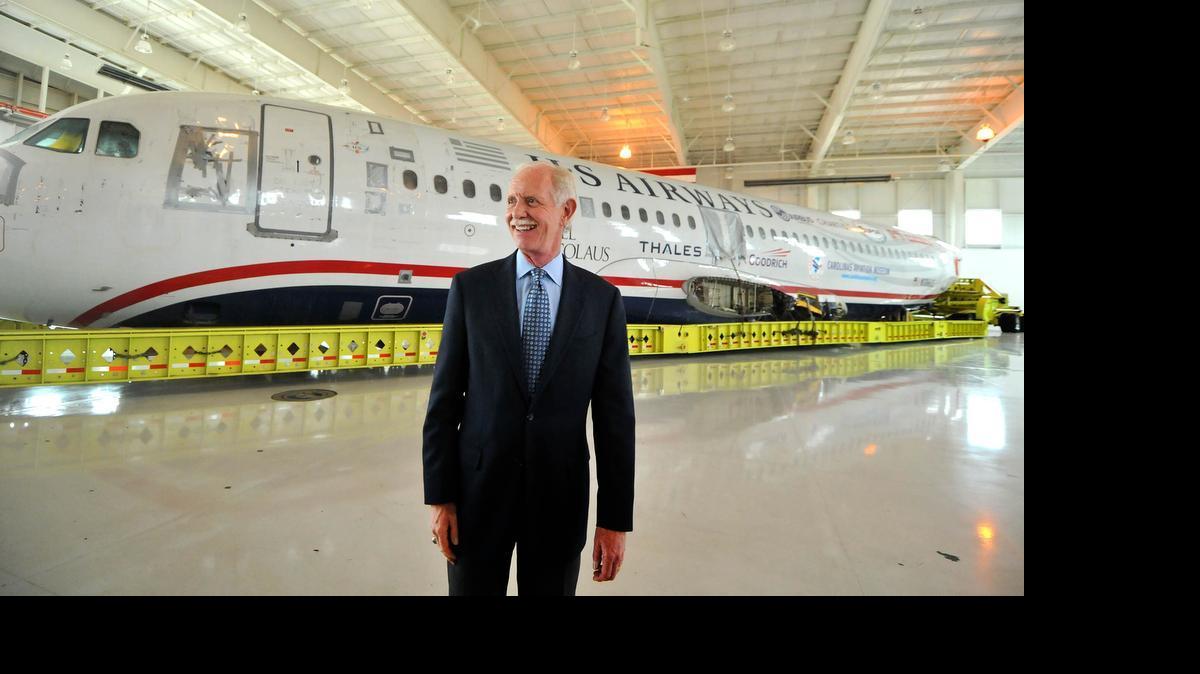 
Capt. Chesley Sullenberger, stands in front of the US Airways flight 1549 fuselage at the Carolinas Aviation Museum Saturday. He and other crew members met with passengers to recall their memorable water landing in the Hudson River and to celebrate the plane's arrival at the museum. 
