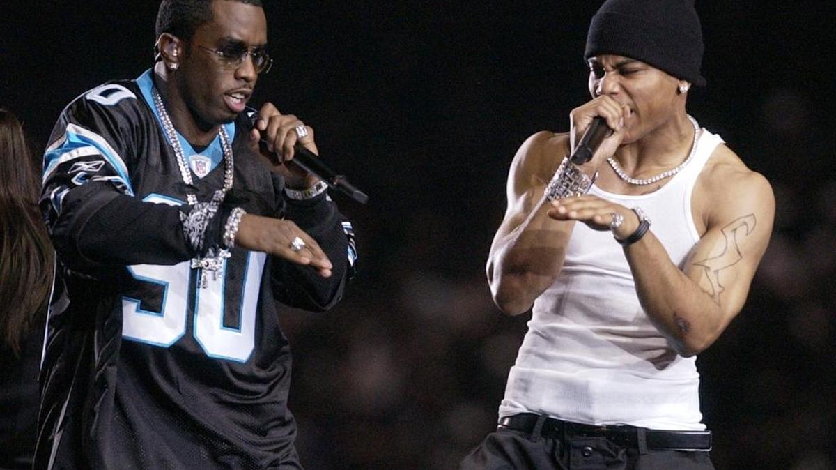 Nelly, right, and Diddy, left, perform during halftime of Super Bowl XXXVII.