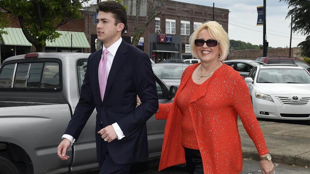 Brooke Covington, a member of the Word of Faith Fellowship church in Spindale, leaves a May 19 hearing at Rutherford County Courthouse accompanied by attorney, Joshua Valentine, in Rutherfordton. Covington and other church members are accused of kidnapping and assaulting Matthew Fenner, a former church member, because he is gay.