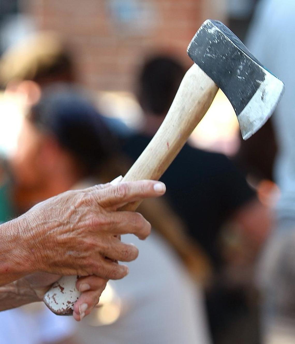 A man gets his grip right before throwing an axe at Common Market.