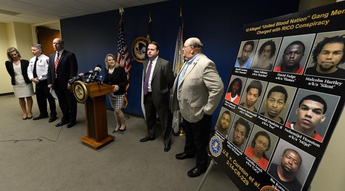 U.S. Attorney Jill Westmoreland Rose and other law enforcement officials announce the April 2015 indictment of 12 suspected United Blood Nation members linked to the killings of Doug and Debbie London.