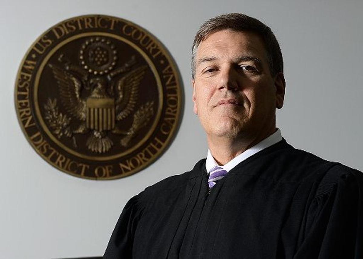 U.S. District Judge Frank Whitney of Charlotte has delayed his ruling in the discrimination lawsuit by a gay Charlotte substitute teacher until the Supreme Court decides a Colorado same-sex dispute next year.