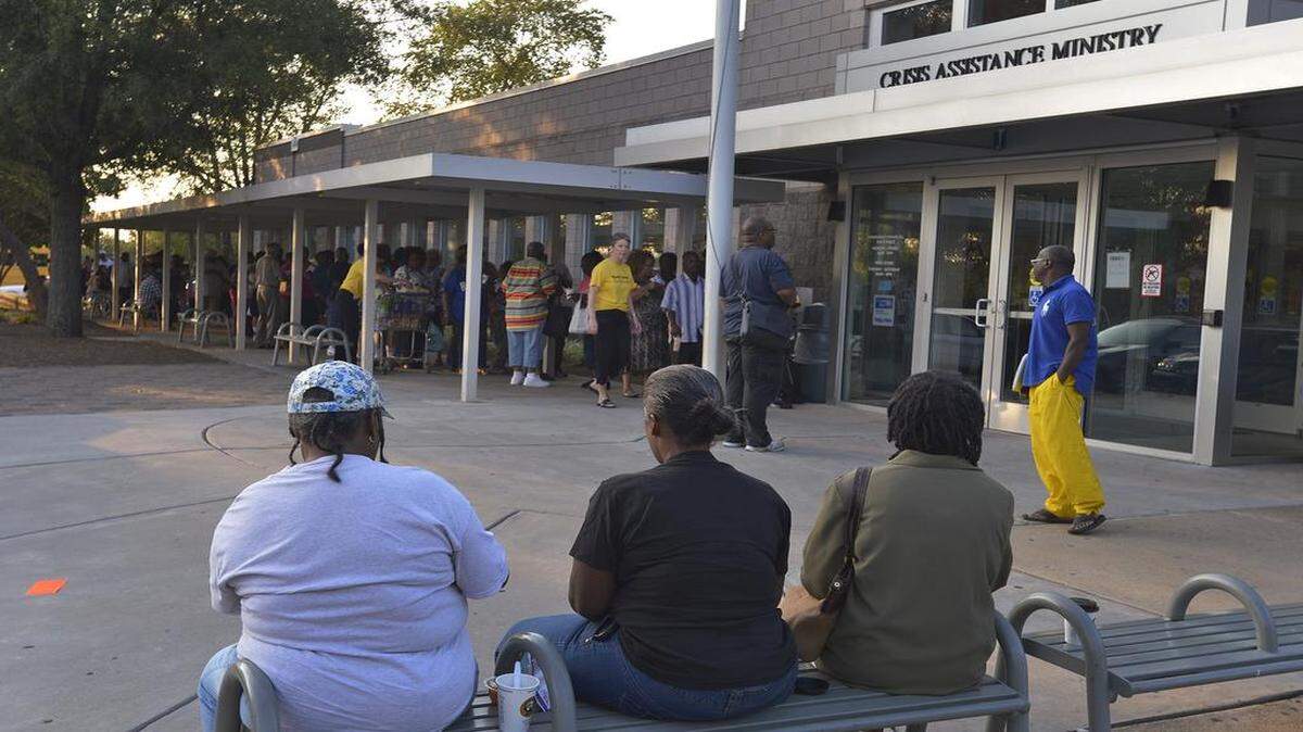 
 People in line at Crisis Assistance Ministry, Wednesday, August 26, 2015, where many people were seeking help with their utility bills after months of hotter than normal temperature in Charlotte.
