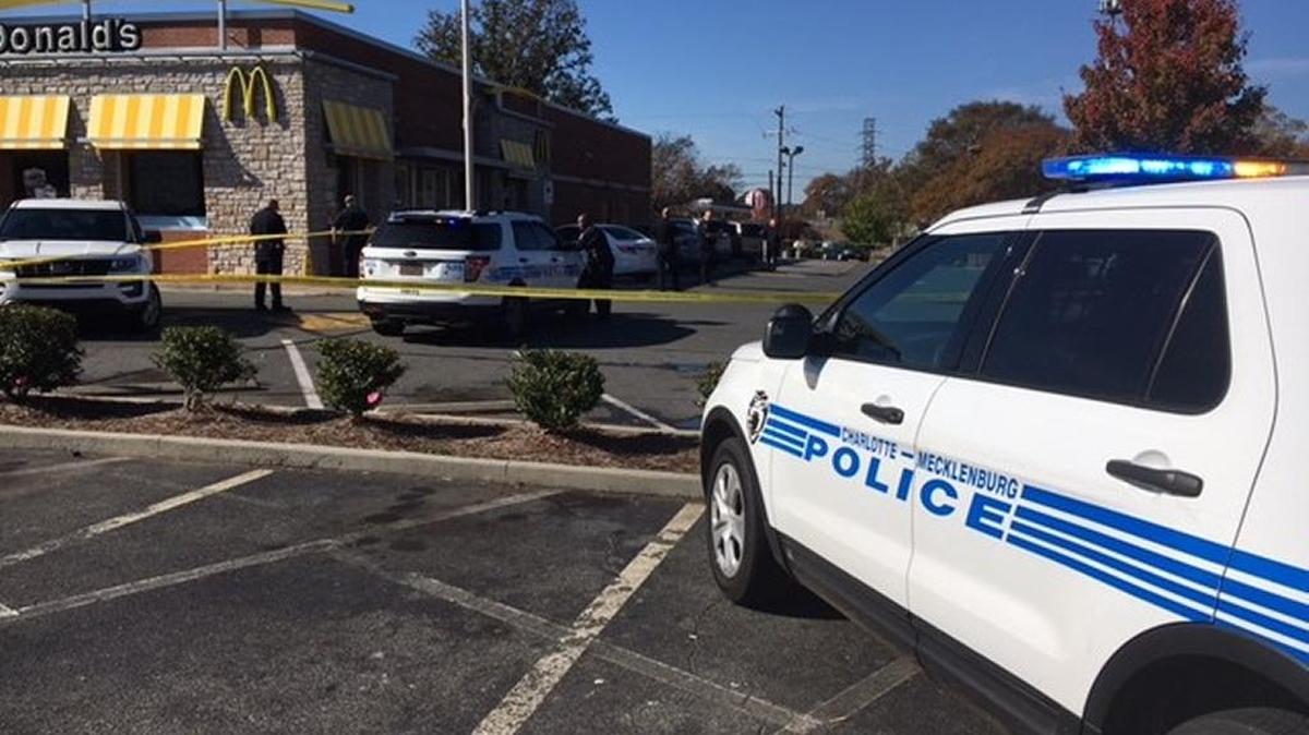 Crime scene tape surrounds parking lot area where shooting is believed to have happened Friday.