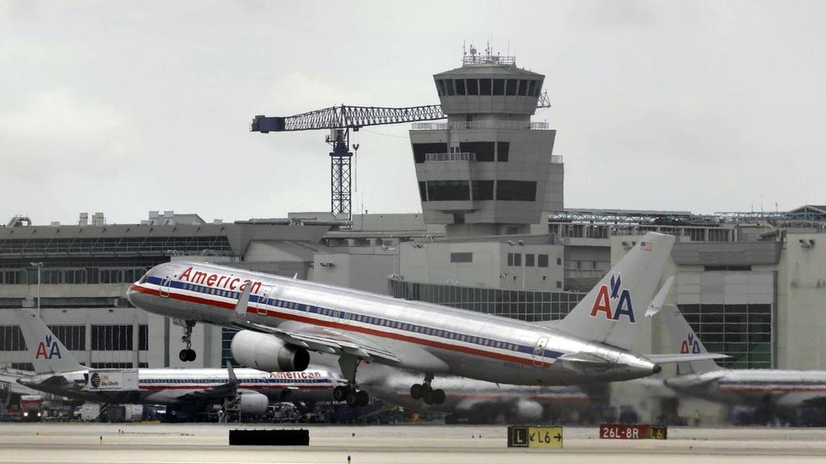 An American Airlines passenger plane takes off  at Miami International Airport in Miami. The airline is adding more routes between the city and Charlotte. 