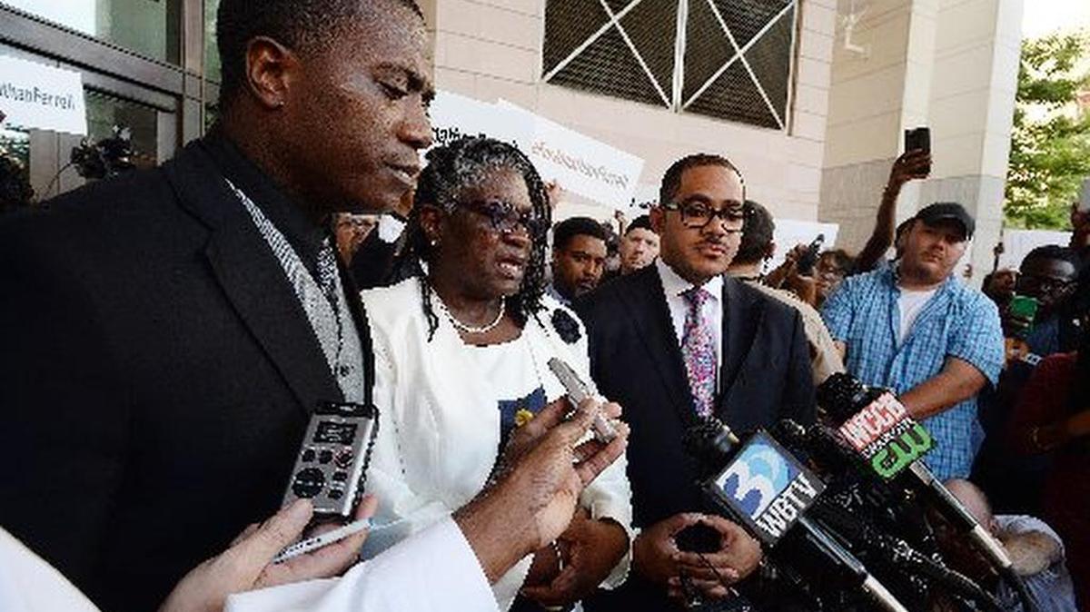
Georgia Ferrell and son Willie address media after a mistrial was declared 
