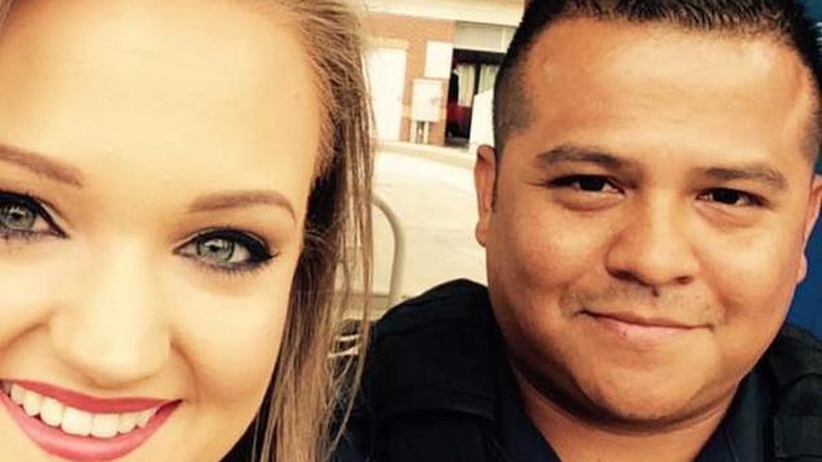 
Kat Hartman and Huntersville police Officer Thomas Bautista
