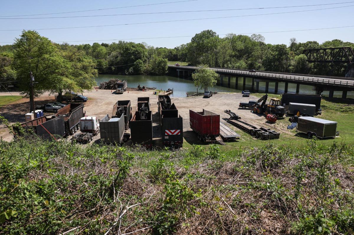 For nearly a month, Corps contractors stationed in Mount Holly have hoisted more than 13,000 cubic yards of debris — nearly all of it trees and other plant debris — out of the river and Dutchman’s Creek. Their primary tool is a 40-foot-long barge with a 28-foot-long claw at the front that can yank up to 5,000 pounds of debris off banks or out of the water with a single grab.