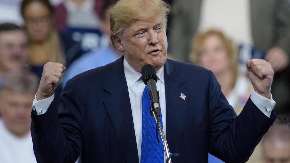 Donald Trump speaks during a rally at the International Exposition Center March 12, 2016 in Cleveland, Ohio. Donald Trump is under fire from rivals who blamed his incendiary rhetoric for a violent outbreak Friday between protesters and supporters at the Republican frontrunner’s rally in Chicago.