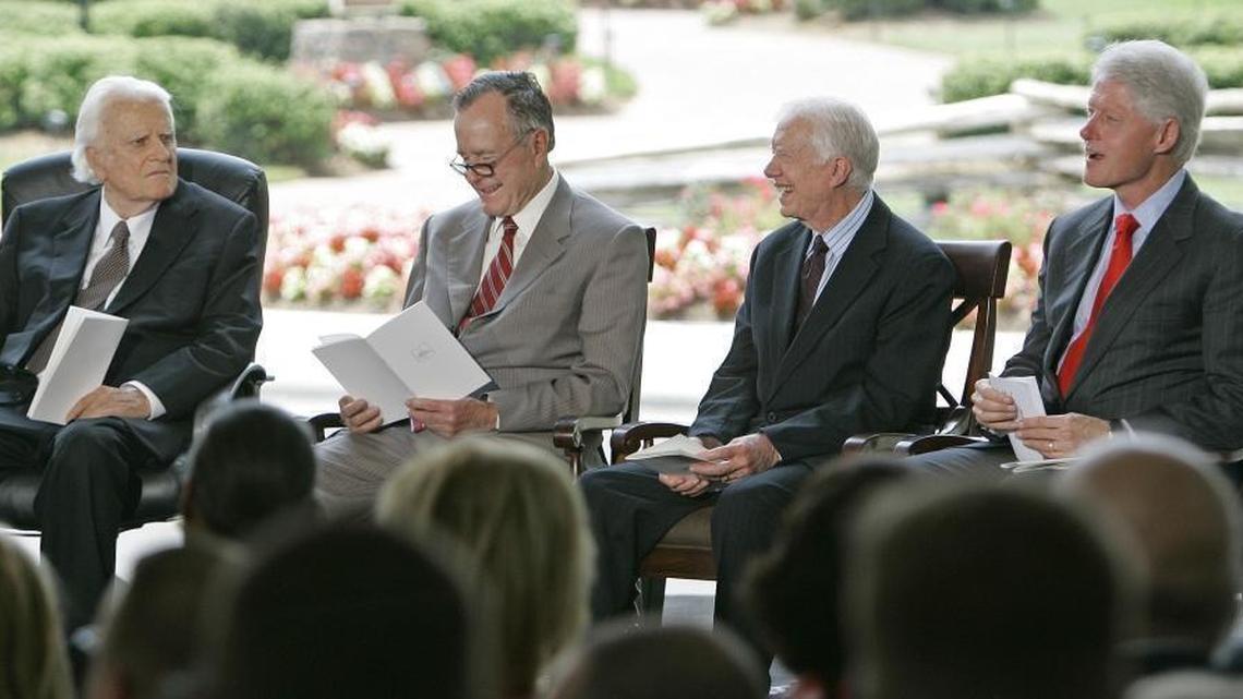Billy Graham, from left, sits with former Presidents George H.W. Bush, Jimmy Carter and Bill Clinton during a dedication ceremony for the Billy Graham Library in Charlotte, N.C., Thursday, May 31, 2007.