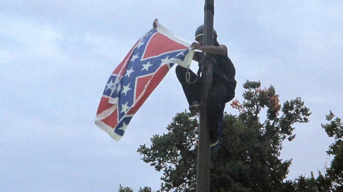 Bree Newsome removes the Confederate battle flag at a Confederate monument at the State House in Columbia, S.C. in June 2015.