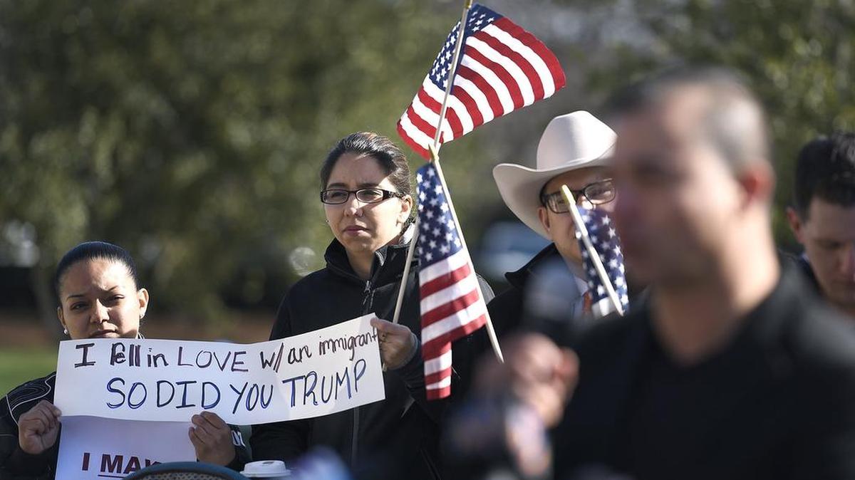 (L-R) Alejandra Morales and Iris Navarro were among about 20 Charlotte area residents, including immigrants, came together outside the Charlotte-Mecklenburg Government Center to protest raids by ICE agents in recent weeks
