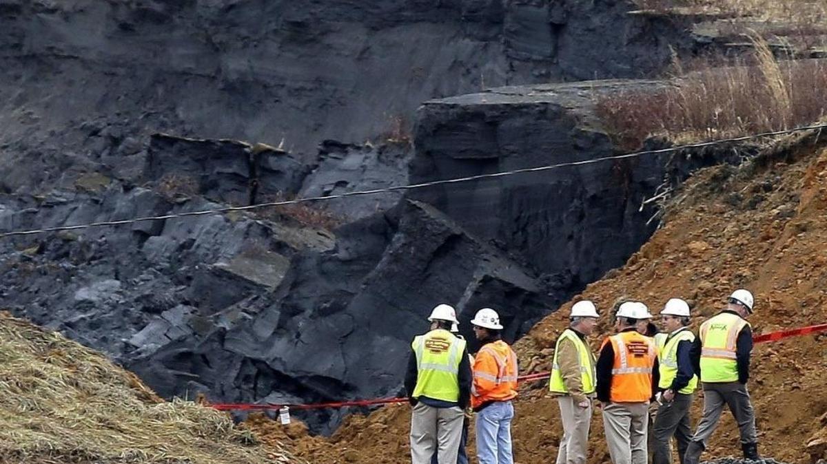 Duke Energy engineers and contractors survey the site of a coal ash spill at the Dan River power plant in Eden in this 2014 photo. Environmental groups say they will sue Duke for not giving the public access to maps that show areas that would flood if coal ash dams fail.