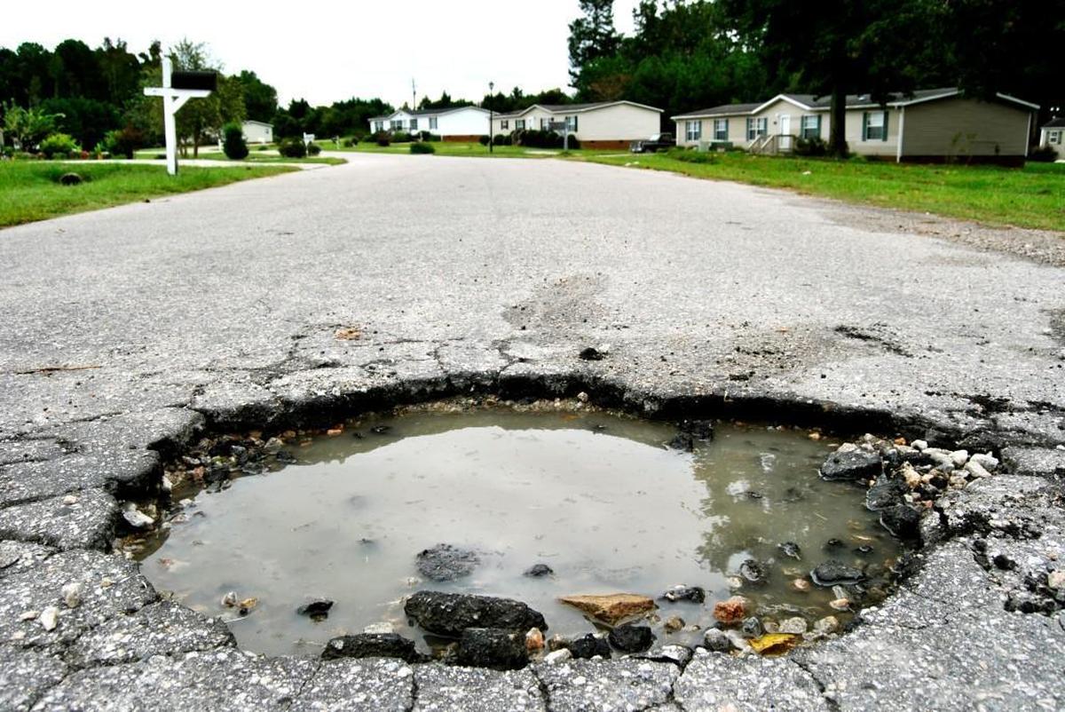 A pothole measuring more than 3 feet across appeared in Wendell in 2012. NCDOT is required to fix any reported pothole within two business days.