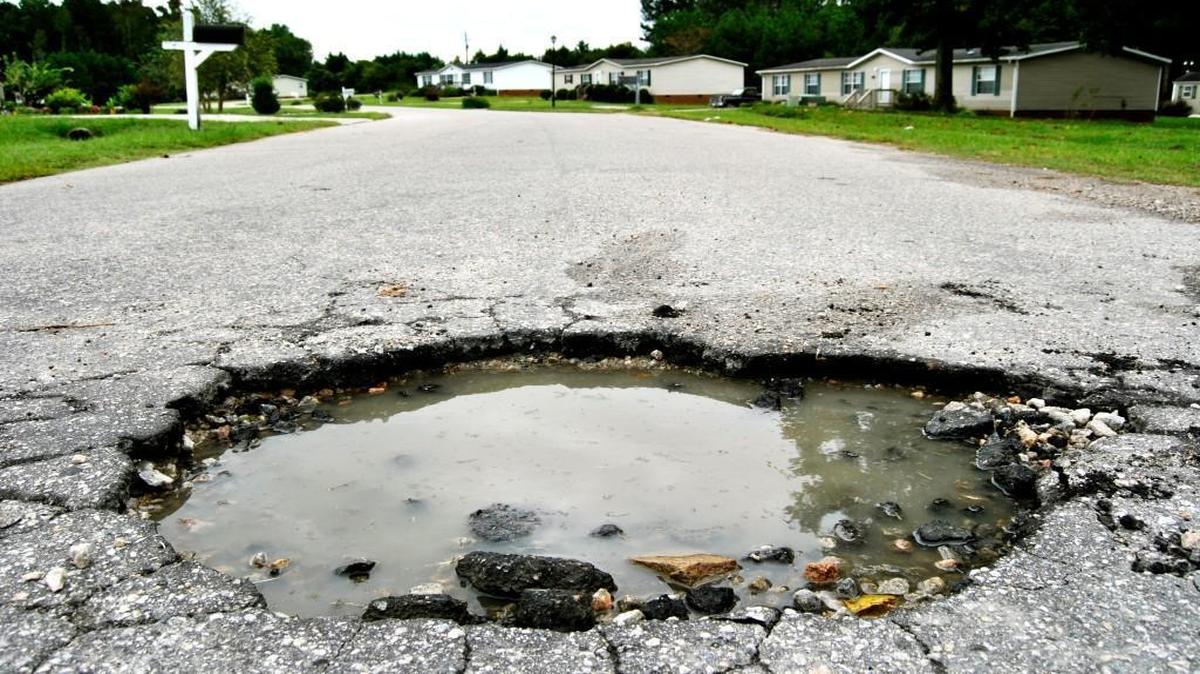 A pothole measuring more than 3 feet across appeared in Wendell in 2012. NCDOT is now required by law to fix any reported pothole within two business days.