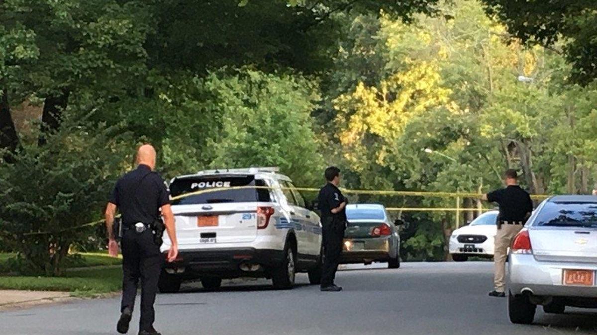 Police say the gray and blue car in front of the CMPD cruiser is connected to the fatal carjacking Friday morning.