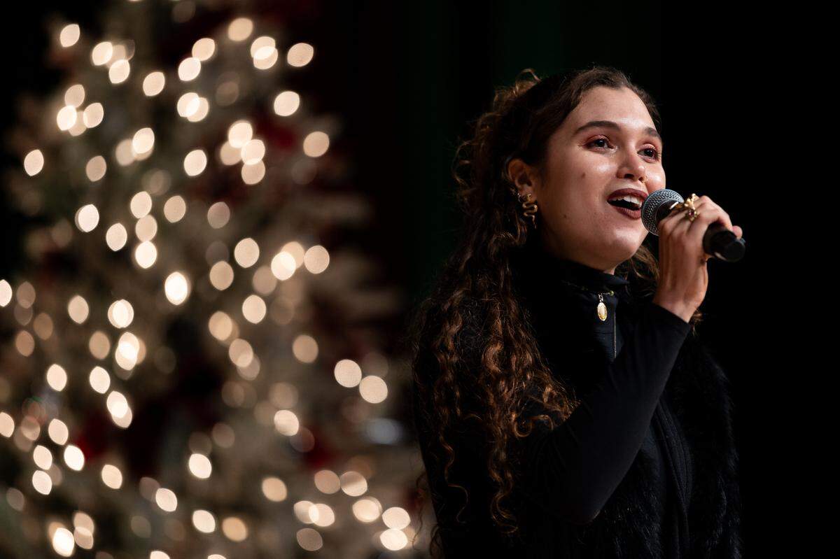 Anna Elise LaFrance sings “God Bless America” during the Good Fellows Luncheon Wednesday.
