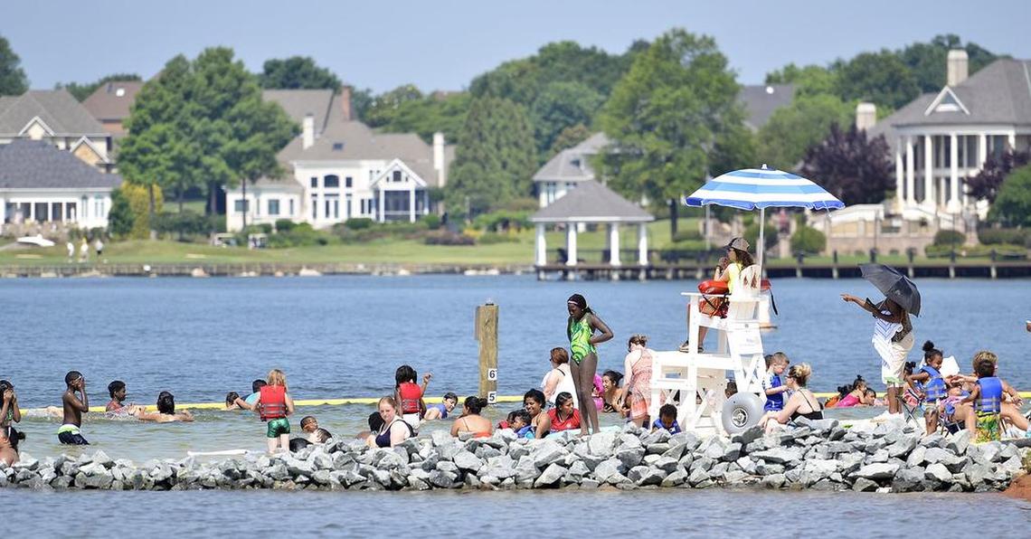 Families enjoy Ramsey Creek beach on Lake Norman in Cornelius.