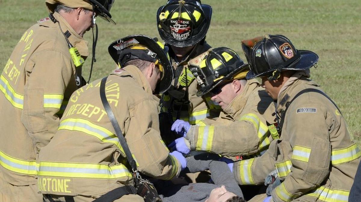 Volunteers on the tarmac getting medical attention playing the role of passengers from a Airbus A319 plane that collided with a small plane. Charlotte Douglas held a Triennial Part 139 Disaster Exercise on Sunday, October 5.
