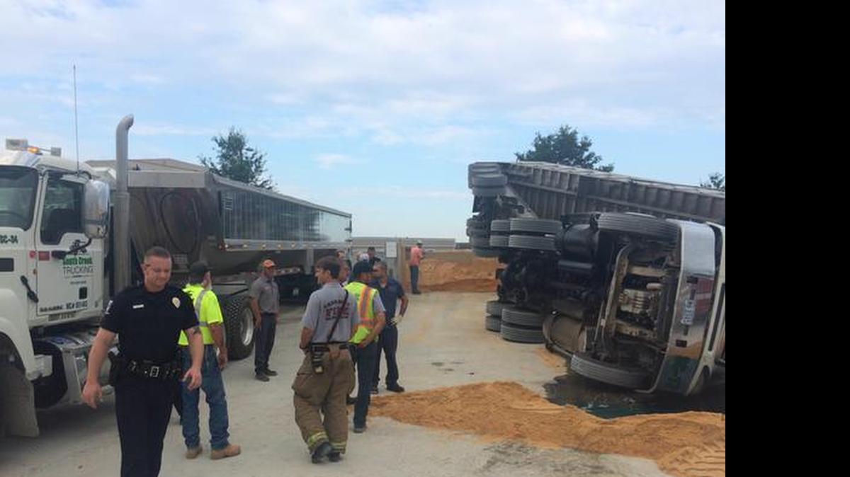 
Eight firefighters helped remove two occupants of a sand truck that overturned at Thomas Concrete in the 3700 block of North Graham Street Thursday morning.

