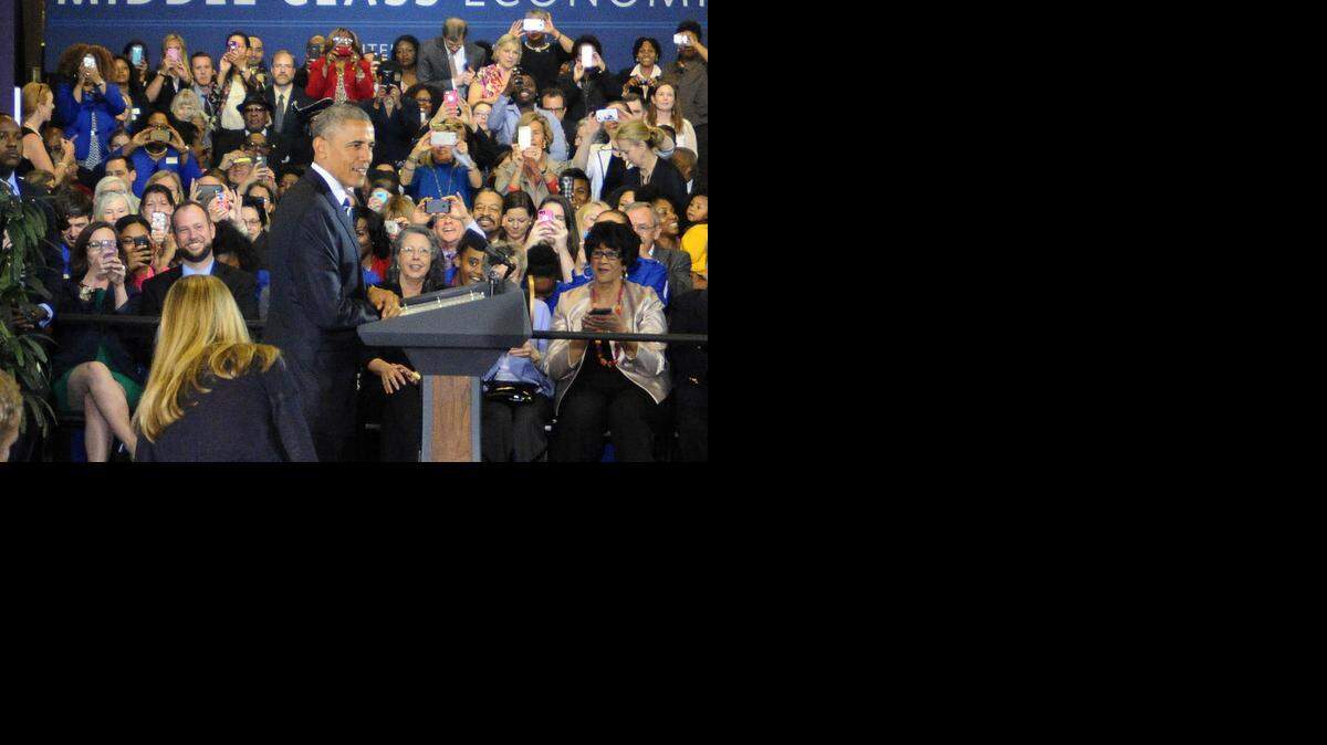 
President Barack Obama visits ImaginOn for a a town hall-style discussion on the Paycheck Fairness Act, his proposal to increase the federal child tax credit and to expand the earned income tax credit, in Charlotte on Wednesday, April 15, 2015.
