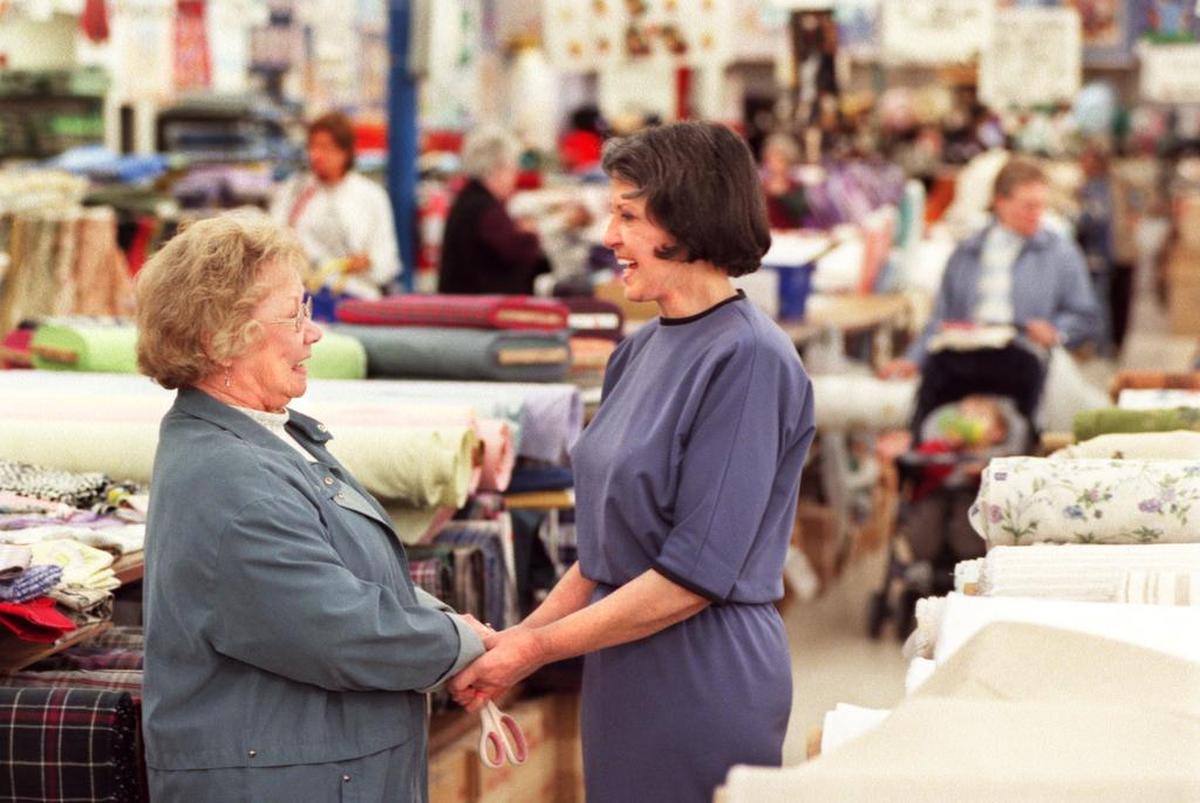 Mary Jo Cloninger, right, greets a customer in 2001, when her Gastonia store celebrated its 50th anniversary.