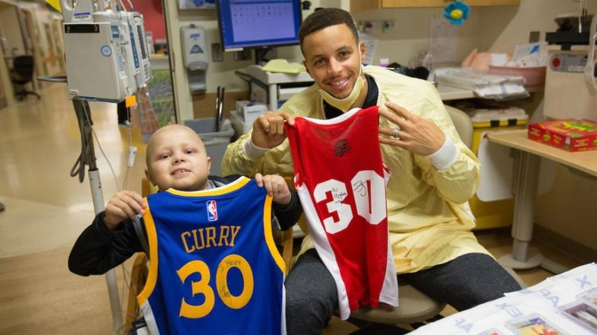 NBA Golden Warriors star Stephen Curry visits Brody Stephens, a patient at Riley Hospital for Children, on Sunday.