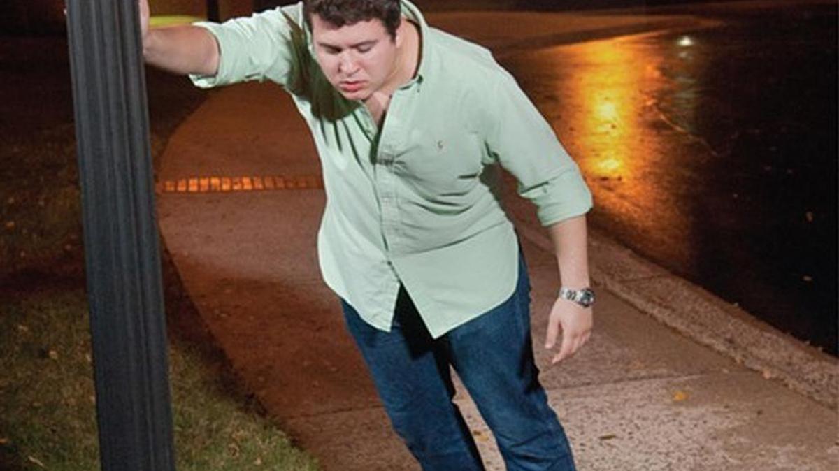 
Businessman Dean Debnam says his “Drunktown” ads, which featured this nauseous-looking man on a sidewalk.
