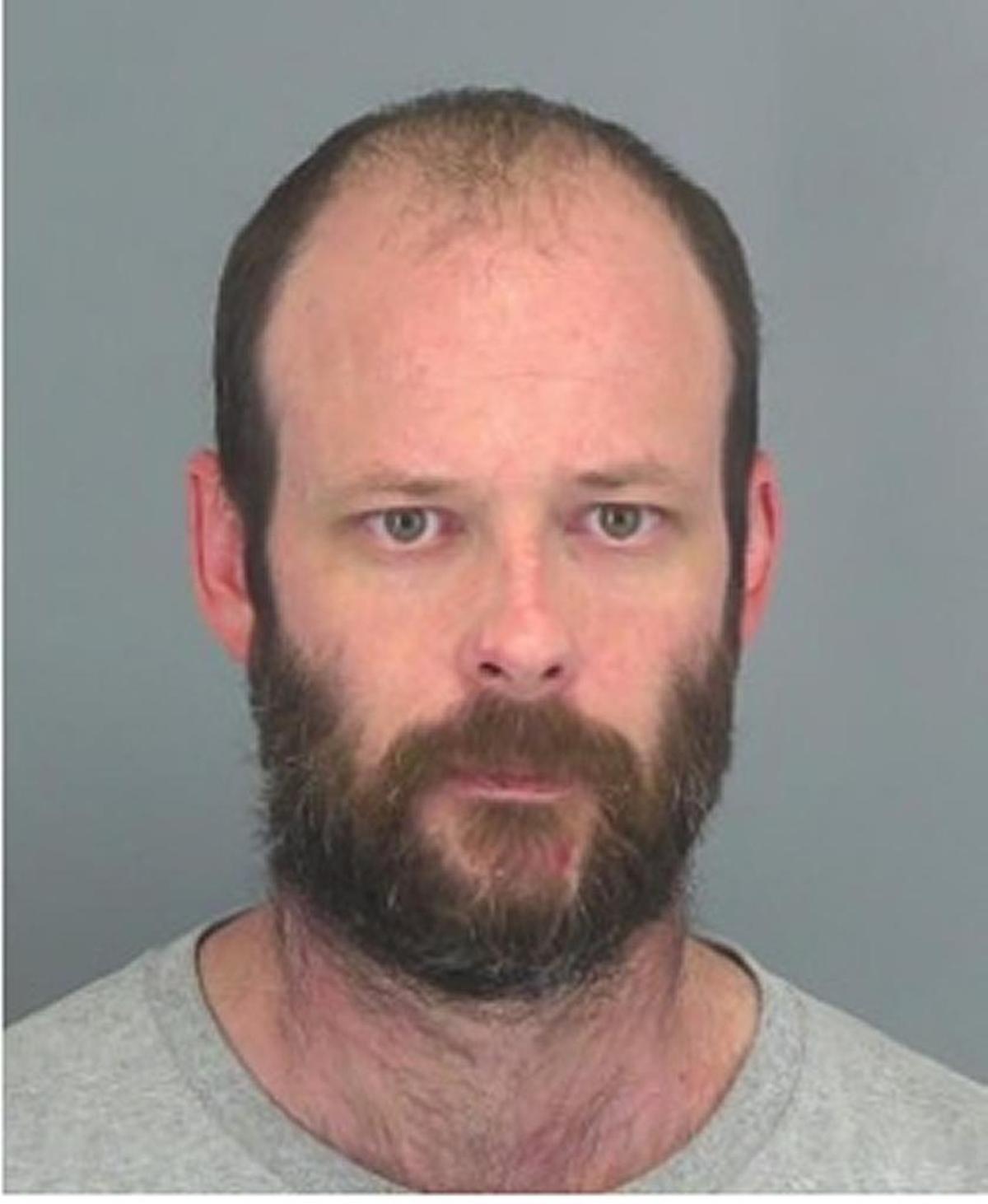 Robert Threadgill, 37, is accused of raping a woman in a gas station bathroom in 2000.