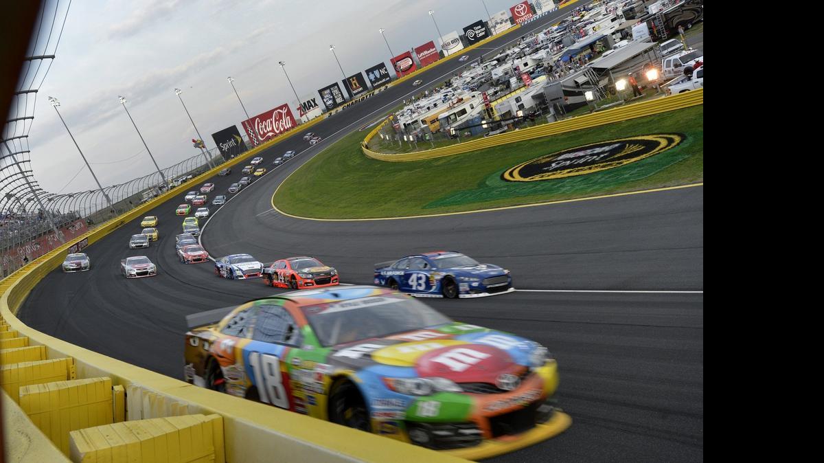 
Kyle Busch (18) runs close to the wall in turn 4 early in the 55th running of the Coca-Cola 600 NASCAR Sprint Cup Race in 2014 at Charlotte Motor Speedway. Gov. Pat McCrory will be at the track Friday to kick off Motorsports Month for North Carolina.
