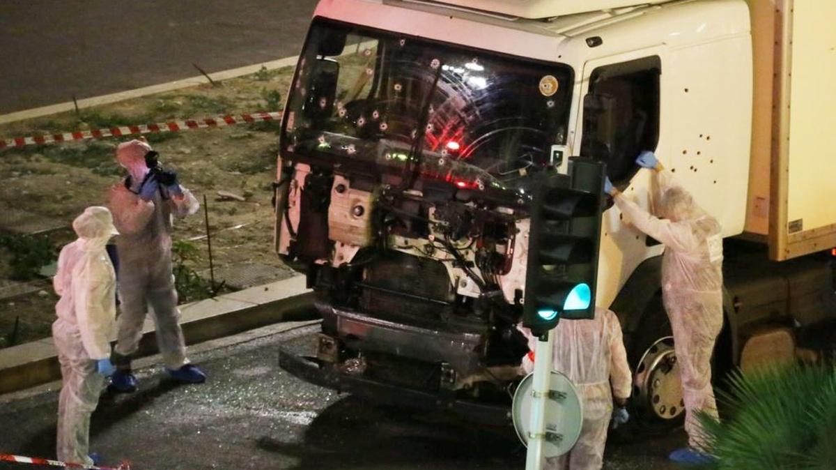 Authorities investigate a truck after it plowed through Bastille Day revelers in the French resort city of Nice, France, July 14, 2016. France was ravaged by its third attack in two years when a large white truck mowed through revelers gathered for Bastille Day fireworks in Nice, killing at dozens of people as it bore down on the crowd for more than a mile along the Riviera city's famed seaside promenade.