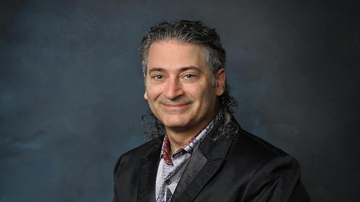 Dr. Steven Wolfe promotes his nonmedical interests — writing, travel, art and photography —on the walls of his Mooresville office, including photos of places he has visited.
