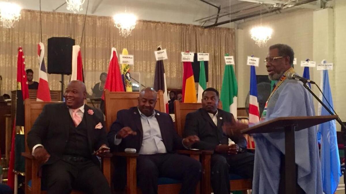 Earl Phillip, second from left, the North Carolina director for the Donald Trump campaign, spoke at a rally to support Trump at Antioch Road to Glory International Ministries on North Davidson Street on Sunday afternoon.
