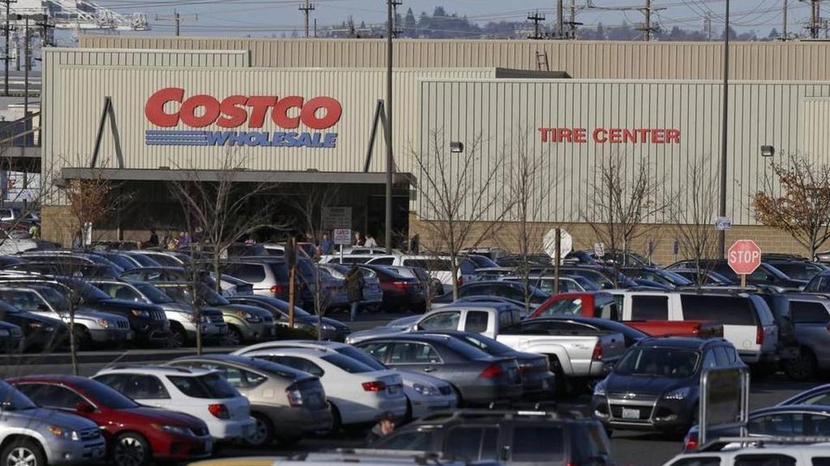 Cars fill the parking lot of a Costco store in Seattle.