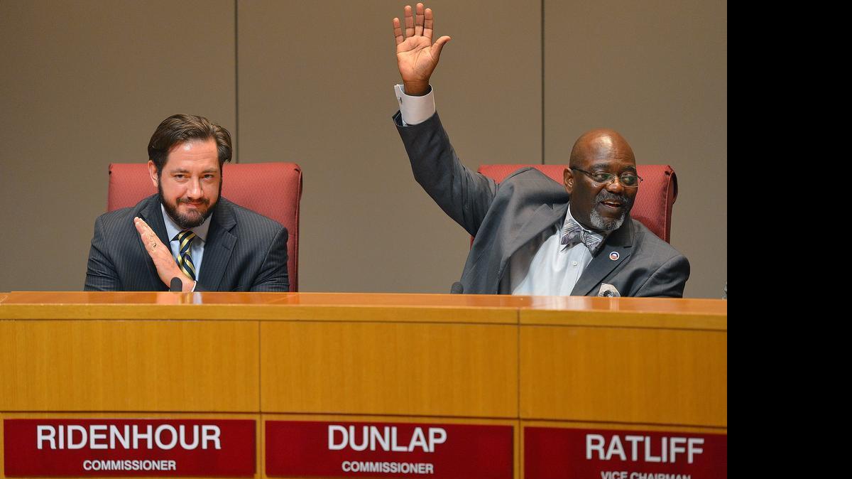 
George Dunlap (right, with fellow Mecklenburg commissioner Matthew Ridenhour) wants to raise commissioners’ pay and double the length of their terms.
