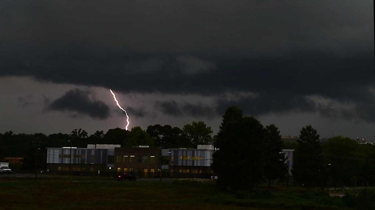 Lightning strikes above the Transform Charter School in west Charlotte on Wednesday, August 19, 2014.