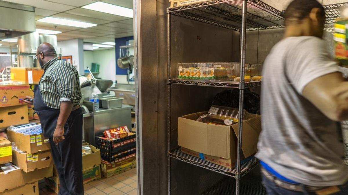 The Men's Shelter of Charlotte has started a $7 million campaign for a complete renovation of its site despite calls from business leaders who want it to move to make room for redevelopment. This is a view inside the shelter from a small walk-in cooler out into the kitchen.